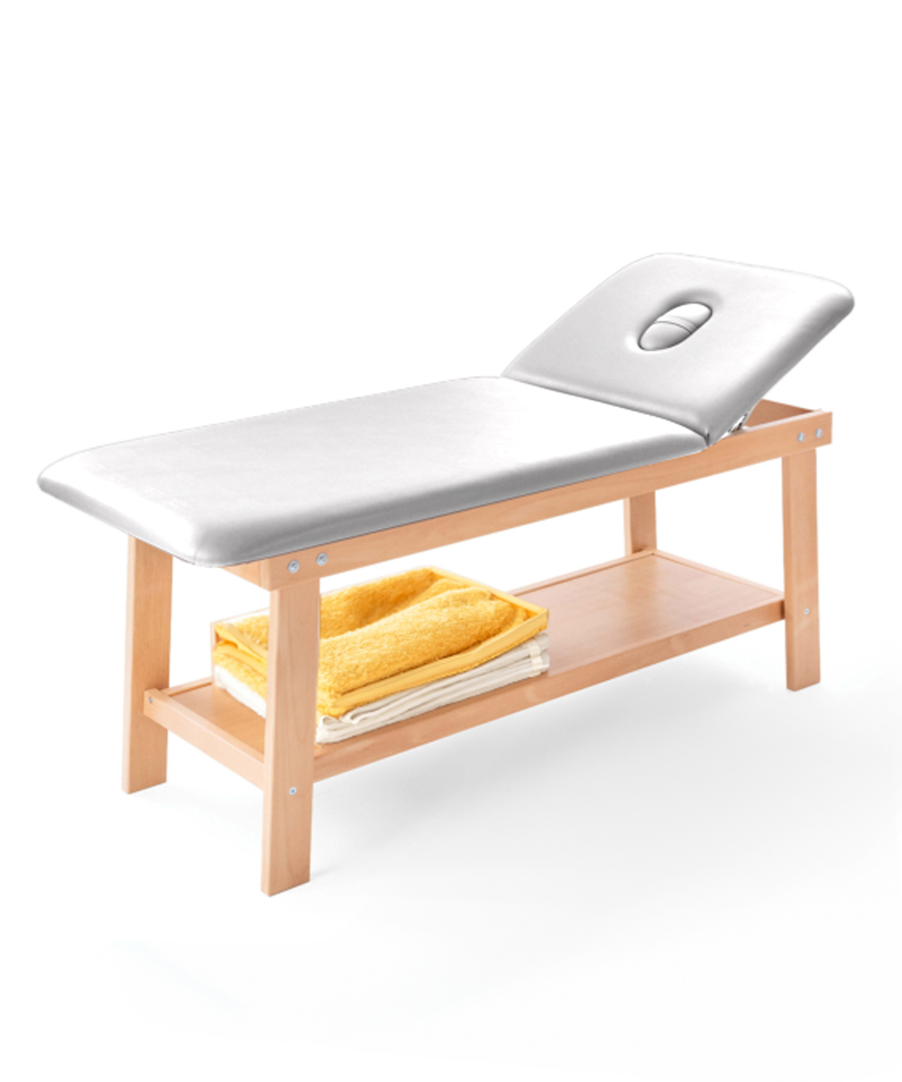 Lettino Alinta in legno massello di faggio con ripiano portaoggetti, schienale regolabile e foro facciale con tappo.