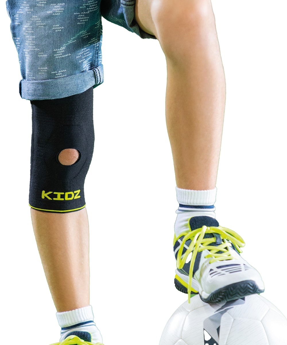 Tutore pediatrico KIDZ-TEK per ginocchio con stabilizzatore rotuleo in silicone, tessuto traspirante Phylotek® e design leggero a calzata rapida.